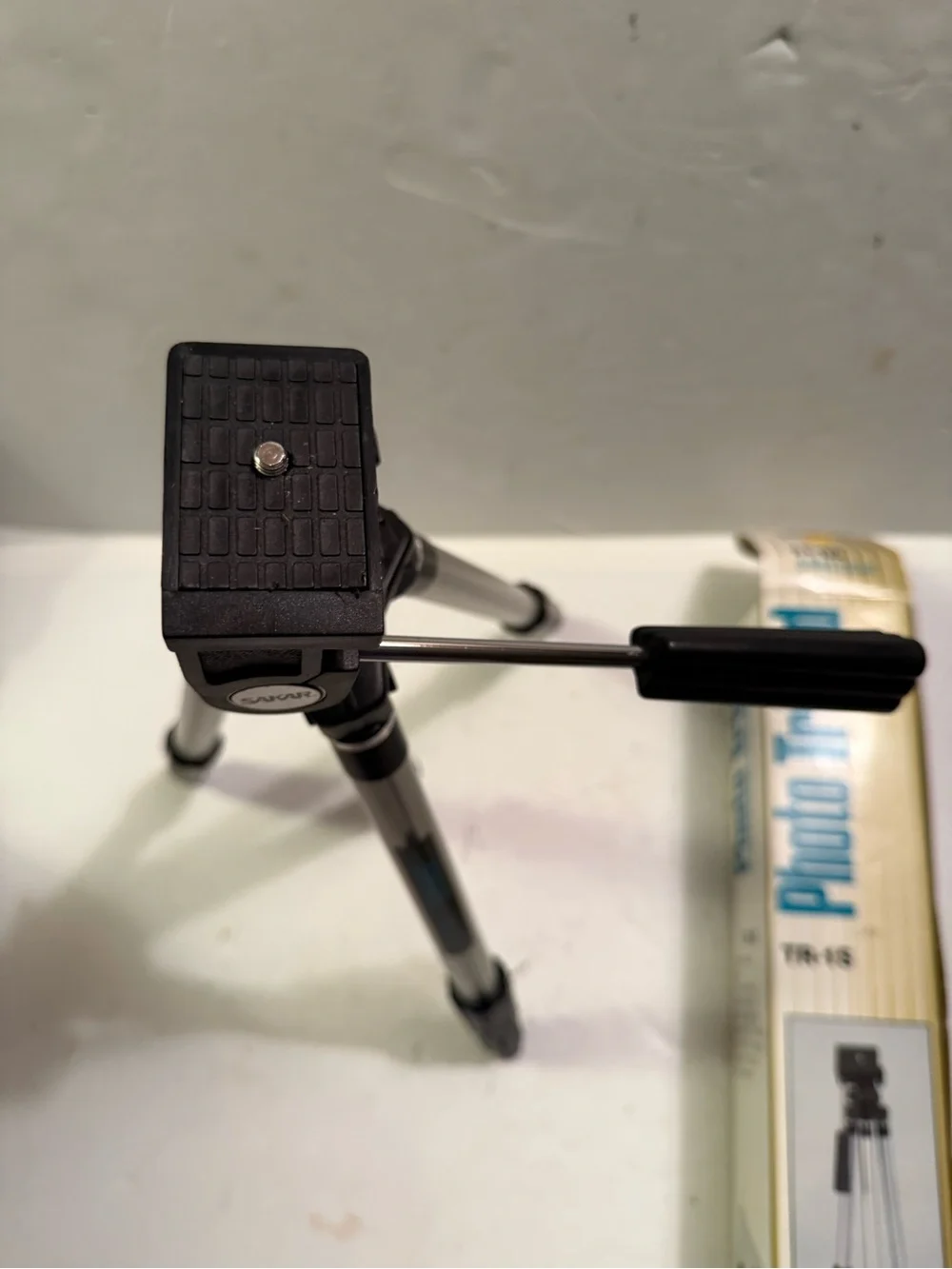 The Sak Silver and Black Camera Tripod with Pan Handle
